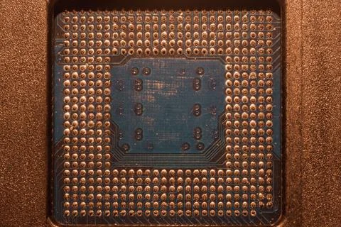 Processor pins macro. computer motherboard close up. cpu pins on a circuit bo Stock Photos