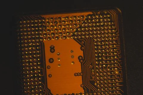 Processor pins macro. computer motherboard close up. cpu pins on a circuit bo Stock Photos