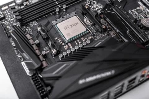 Processor Ryzen 7 2700X against the background of a computer motherboard Asus 写真素材