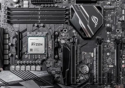 Processor Ryzen 7 2700X against the background of a computer motherboard Asus 写真素材