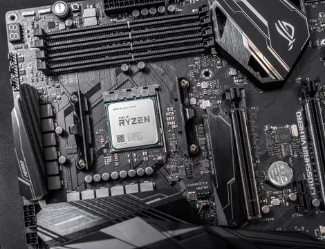 Processor Ryzen 7 2700X against the background of a computer motherboard Asus Foto stock
