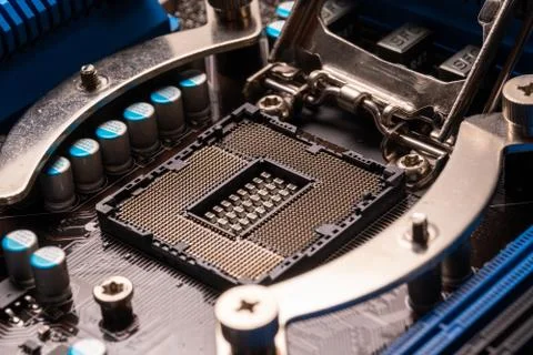 Processor socket on motherboard computer motherboard with blue heatsinks and  Stock Photos