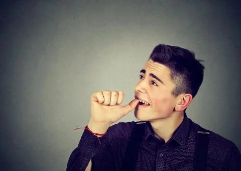 Procrastinating young man wasting time Stock Photos