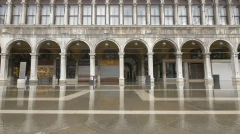 Procuratie Nuove's arcades and restaurants seen during floods in Venice Stock Footage 59887052