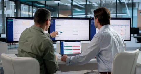 Procurement Manager Reviews Software Solution On Laptop For Supply Chain Opti Stock Photos