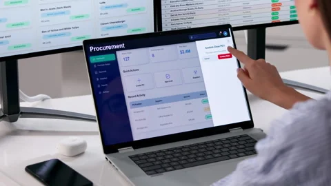 Procurement Manager Reviews Supplier Data On Multiple Screens Stock-Footage 333843907