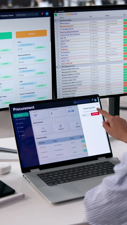 Procurement Manager Reviews Supplier Data On Multiple Screens Stock Footage 334526637
