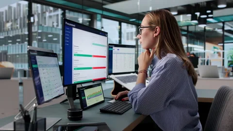 Procurement Manager Reviews Vendor Contracts Using Software Stock Footage 340401418