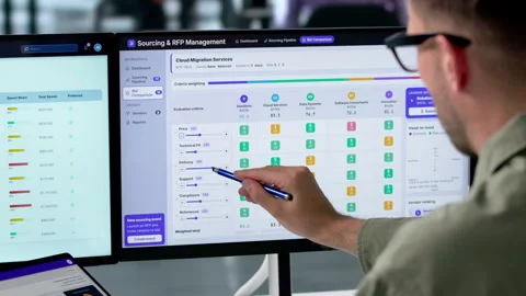 Procurement Manager Reviews Vendor Proposals Using Digital Dashboard Stock Footage 339890645