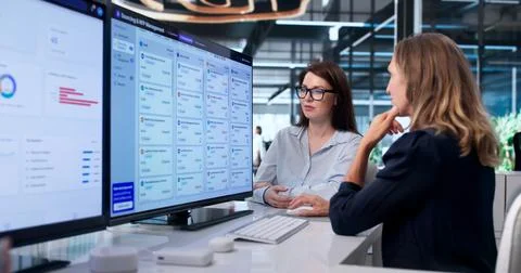 Procurement Manager Studies Vendor Proposals On Her Computer Screen. Stock Photos