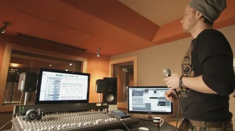 Producer explaining something in recording studio - tracking shot Stock Footage 21521917