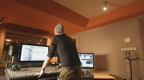 Producer explaining something in recording studio - tracking shot Stock Footage 21603341