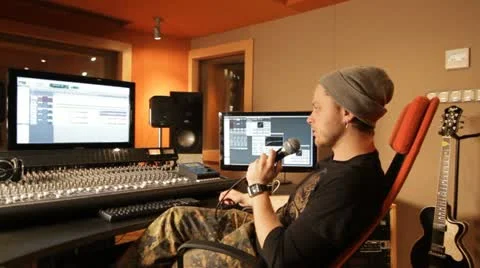 Producer explaining something in recording studio - tracking shot Stock Footage 21750007