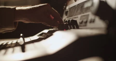 Producer turning knobs on soundboard Stock Footage 201849310