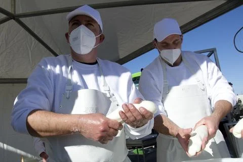 Producers while producing mozzarella, during the demonstration of the general Stock Photos