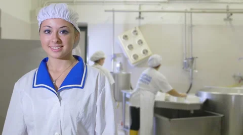 Producing cheese: worker inside typical italian dairy factory Stock Footage 42996554