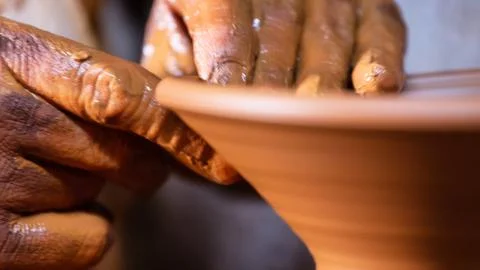 Producing the earthenware or earthen jar with hand. Stock Photos