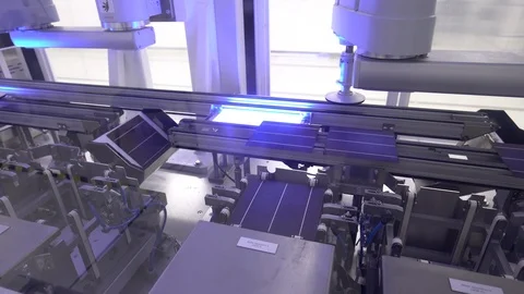 Producing solar cells panels discharged from mechanic column. Handheld Stock Footage 107094982