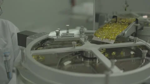 Producing yellow pills Stock Footage 156064851