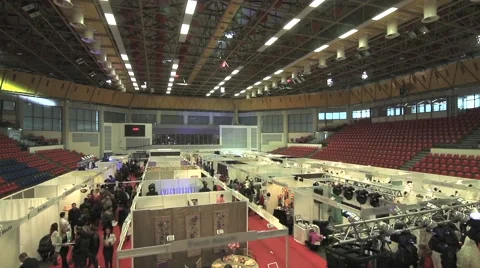 Product borough held in a multipurpose hall where traders have arranged many Stock Footage 62244852