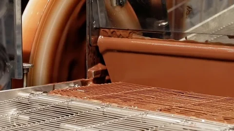 Product conveyor line on a chocolate factory Stock Footage