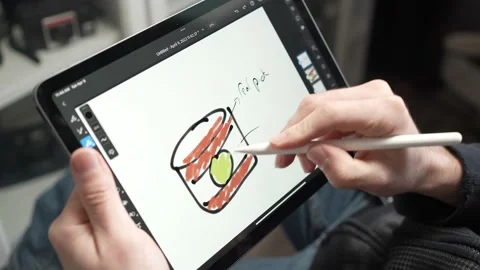 Product Designer Taking Notes With a Pen on a Tablet Screen Stock Footage 178176266