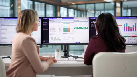 Product Manager Reviews Split Test Results On Computer Stock Footage 347286424
