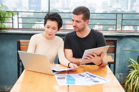 Product managers discussing interface design Stock Photos