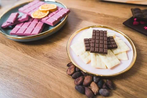 Product presentation concept. Various bars of chocolate on wooden table. Ruby 写真素材