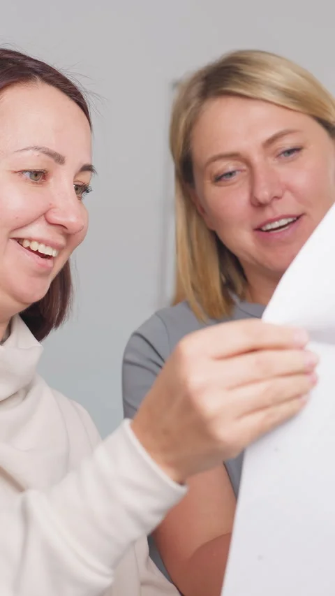 Product team collaboratively reviewing sample adjustments together, Bright Stock Footage 326922685