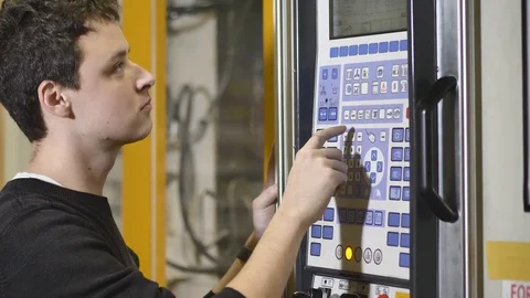 Product Worker, Machine Adjuster Adjusts the Automatic Injection Molding Machine 動画素材 127030627