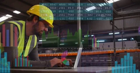 Production alert popping up, worker leaning over laptop, typing and checking Stock Footage 334112172