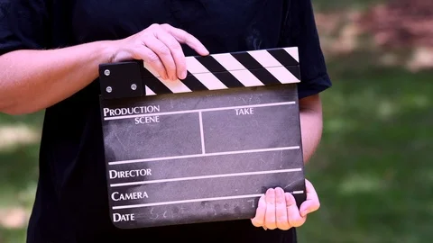 Production assistant using a clapboard Stock Footage 93969481