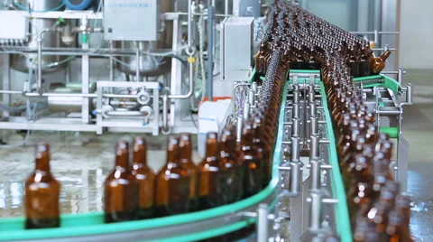 Production of beer in glass bottles. Beer manufacturing Stock Footage