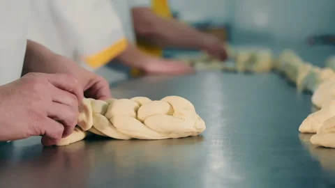 Production of braided bread, braided bread. Close up. A bakery, the baker's Stock Footage 254282161