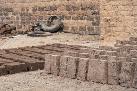 Production of clay brick in stacks, bricks are arranged on one by one Stock Photos