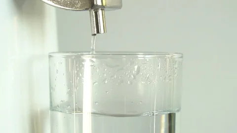 Production of clean water. Water dropping into glass. Slow motion Close up Stock Footage 101160293