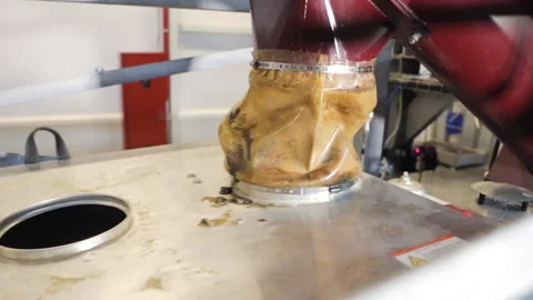 Production. Close up of a hose through which raw materials arrive. equipment at Stock Footage 194448603