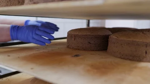 Production of confectionery products. The process of baking and impregnation of Stock Footage 171894928