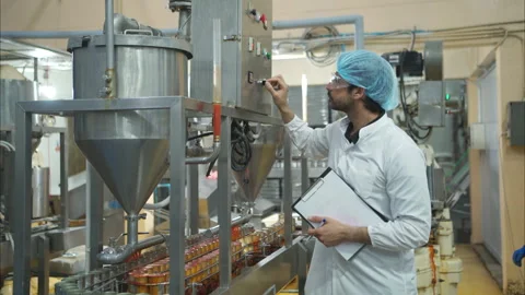 The production control supervisor inspects and controls the operation Stock Footage 308309451