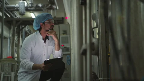 The production control supervisor inspects and controls the operation Stock Footage 308310548