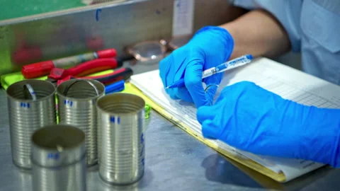 Production control supervisor inspects the can in the production line Stock Footage 339005531