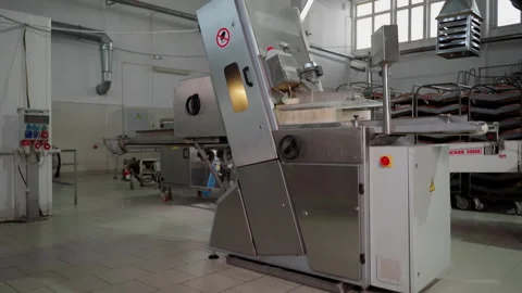 Production conveyor for slicing and packaging bread indoors Stock Footage 250267641