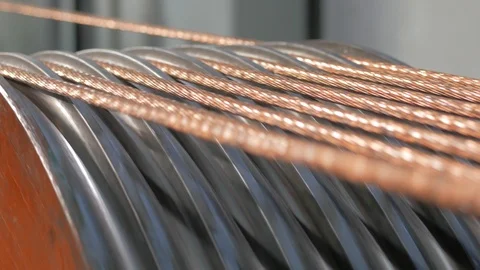 Production of copper cable. Rotating shafts with copper wire. Cable plant Stock Footage 124075797
