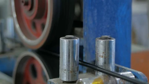 Production of copper cable. Rotating shafts with copper wire. Cable plant Stock Footage 124081262