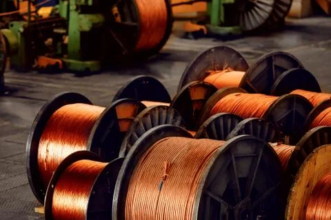 Production of copper wire, bronze cable in reels at factory Stock Photos