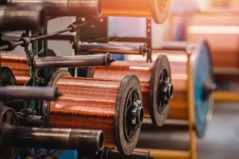 Production of copper wire, bronze cable in reels at factory Foto stock