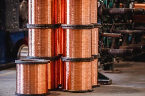 Production of copper wire, bronze cable in reels at factory 스톡 사진