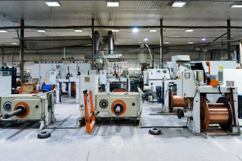 Production of copper wire, bronze cable in reels at factory Stock Photos