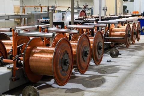 Production of copper wire, bronze cable in reels at factory Stock Photos